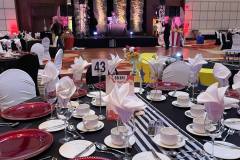 black-white-striped-tablecloths-red-charger-plate-circus-theme-corporate-decor-hilton-lac-leamy-1
