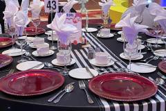 black-white-striped-tablecloths-red-charger-plate-circus-theme-corporate-decor-hilton-lac-leamy-10