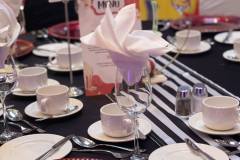 black-white-striped-tablecloths-red-charger-plate-circus-theme-corporate-decor-hilton-lac-leamy-7